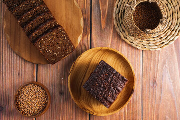 homemade bread with seeds on a wooden background
