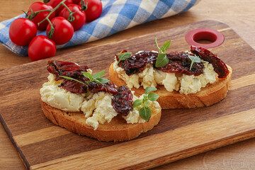 Bruschetta with soft cheese and tomato