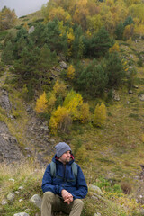 Fototapeta premium Traveller, tourist with a backpack in mountains. Active life concept.