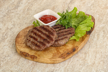 Grilled beef burger cutlet with sauce