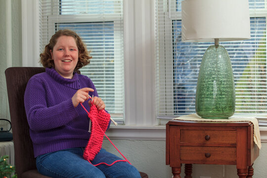 Young woman with Autism knitting for the holidays