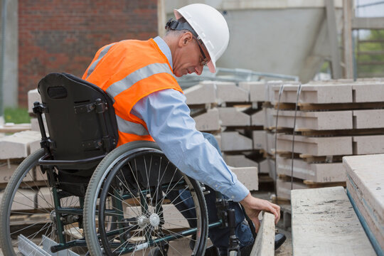 Project engineer with a Spinal Cord Injury in a wheelchair at job site