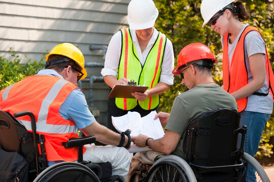 Project engineers with Spinal Cord Injuries discussing data at new building site
