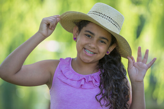 Portrait of Hispanic teen girl smiling with braces on her teeth
