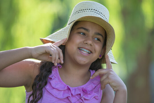 Portrait of Hispanic teen girl with braces smiling