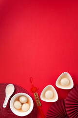 Chinese Lunar New Year Concept. Sweet Rice Dumplings Balls Tangyuan on Red Table
