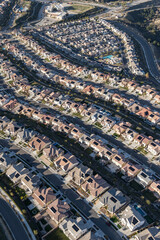 Vertical aerial view of new suburban Santa Clarita neighborhoods in Los Angeles County, California. - obrazy, fototapety, plakaty