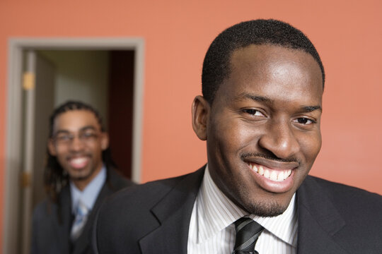 Portrait of smiling young businessmen.