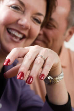 Close up of mature womans showing her wedding ring.