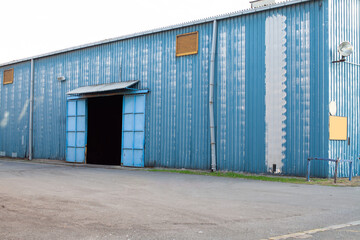 Fototapeta na wymiar warehouse hangar with corrugated metal walls