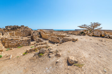 The ruins of the ancient 3rd Century BC fortified port city of Sumhuram, an import harbor for frankincense trade, at Khor Rori, or Khawr Rawri lagoon in the Dhofar region of Oman.