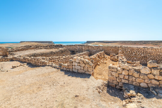 The ruins of the ancient 3rd Century BC fortified port city of Sumhuram, an import harbor for frankincense trade, at Khor Rori, or Khawr Rawri lagoon in the Dhofar region of Oman.
