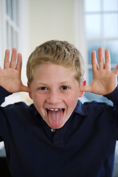 Portrait of a boy teasing.