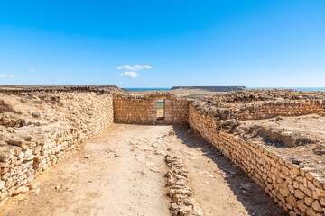The ruins of the ancient 3rd Century BC fortified port city of Sumhuram, an import harbor for frankincense trade, at Khor Rori, or Khawr Rawri lagoon in the Dhofar region of Oman.