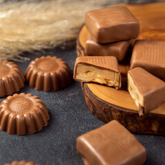 Tasty chocolate close up on black background