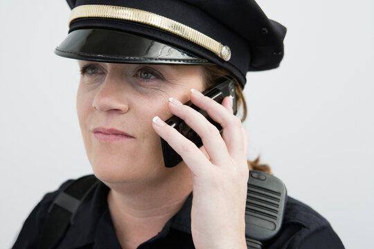 View of a police woman talking on the mobile phone.