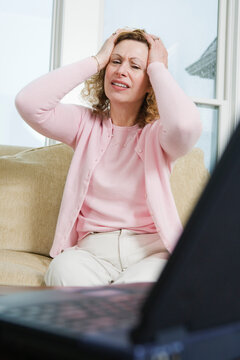 View of a mature woman expressing sadness.