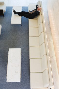 Elevated view of a businessman relaxing in an office.