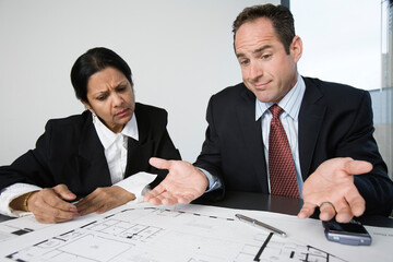 View of an architect discussing with a businesswoman.