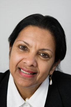 Portrait of a businesswoman against white background.