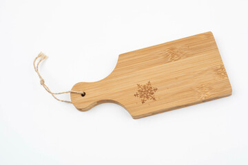 Small Snowflake cutting board for christmas on white background, isolated