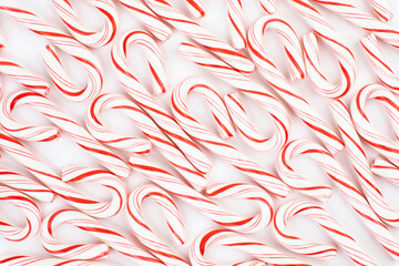 Top view of several candy canes on white background