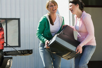 Women carrying television
