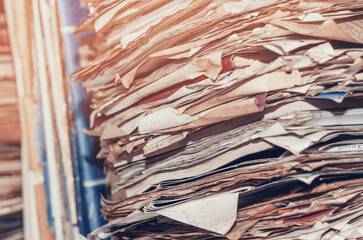 Old yellowed papers, documents on the shelves - obrazy, fototapety, plakaty