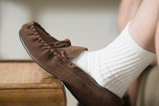 Close-up of a man's foot in a slipper