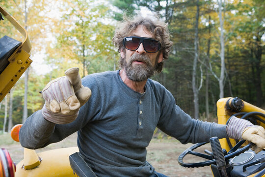 Man sitting on front-end loader