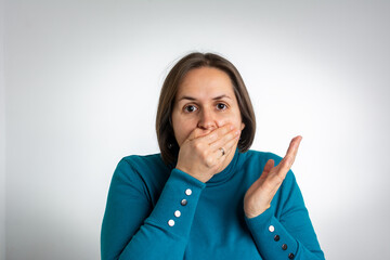 Woman covering mouth
