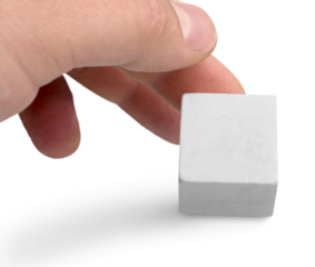 Hand holds wood block stacking