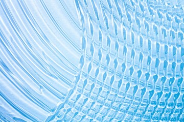 Cosmetic blue transparent texture. Serum or shower gel, shampoo background