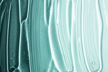 Cosmetic green transparent texture. Serum or shower gel, shampoo background