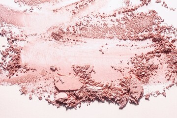 Bronzer or blusher and compact powder brown nude smudge textured background