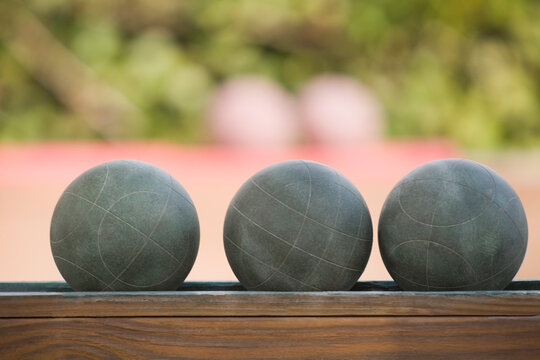 Close-up of three bocce balls