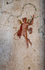 detail of ancient fresco of winged deities in a house in Pompeii. Pompeii was destroyed by the volcanic eruption of Vesuvius in 79 BC