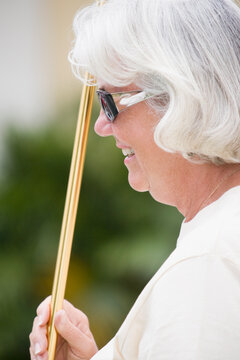 Close-up Of A Senior Woman Playing Shuffleboard