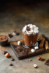Hot chocolate with marshmallows on dark background. Hot beverage with cocoa 