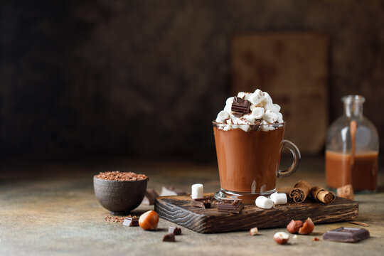 Hot chocolate with marshmallows on dark background. Hot beverage with cocoa 