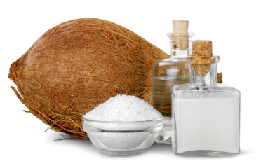 Coconut and a bottle with coconuts milk and grated coconut