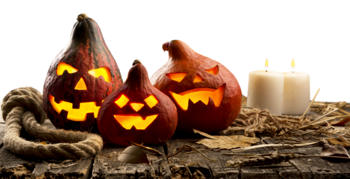 Halloween pumpkin on the desk with a scary face