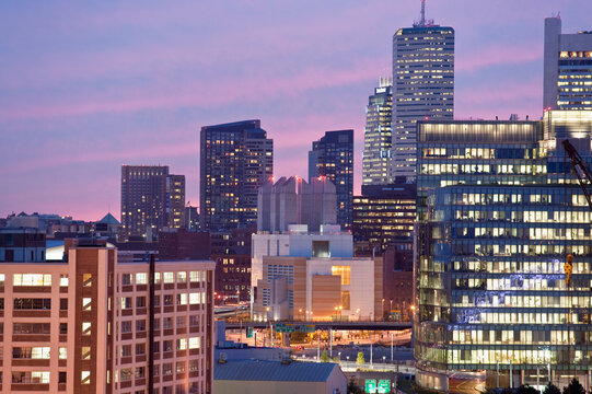 Buildings lit up at dusk, Seaport District, Boston, Massachusetts, USA