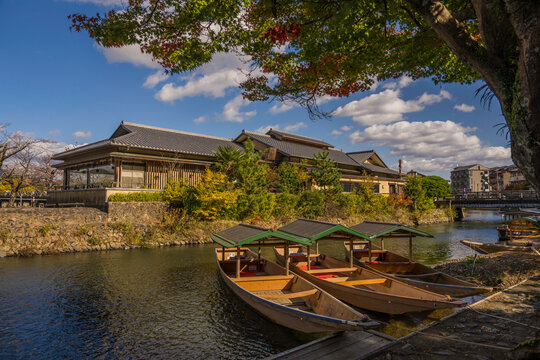 This image shows traditional boats in a Kyoto Japan landscape.