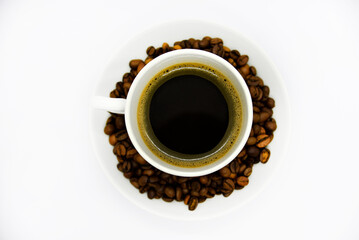 Porcelain coffee cup on a white background. Delicious coffee in a cup and coffee beans.