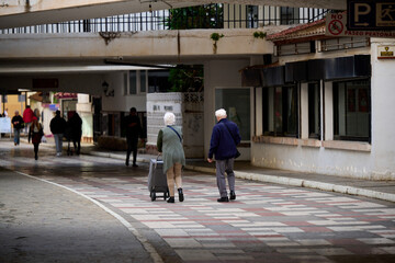 old people walking on the street
