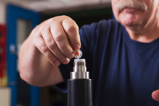 Engineer rebuilding an O2 electrochemical sensor probe in a laboratory
