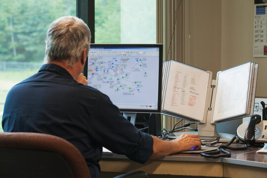 One engineer on computer starting up the water treatment plant in program for supervisory control and data acquisition