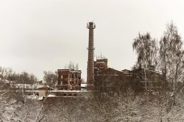  Old abandoned industrial factory building. Ruined historic building. Chimney pipe © Evgenii