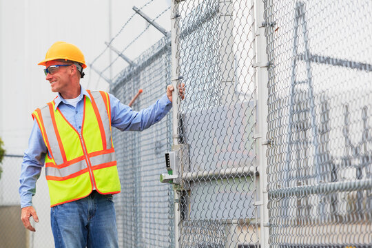 Electrical engineer using security system to enter electrical power plant